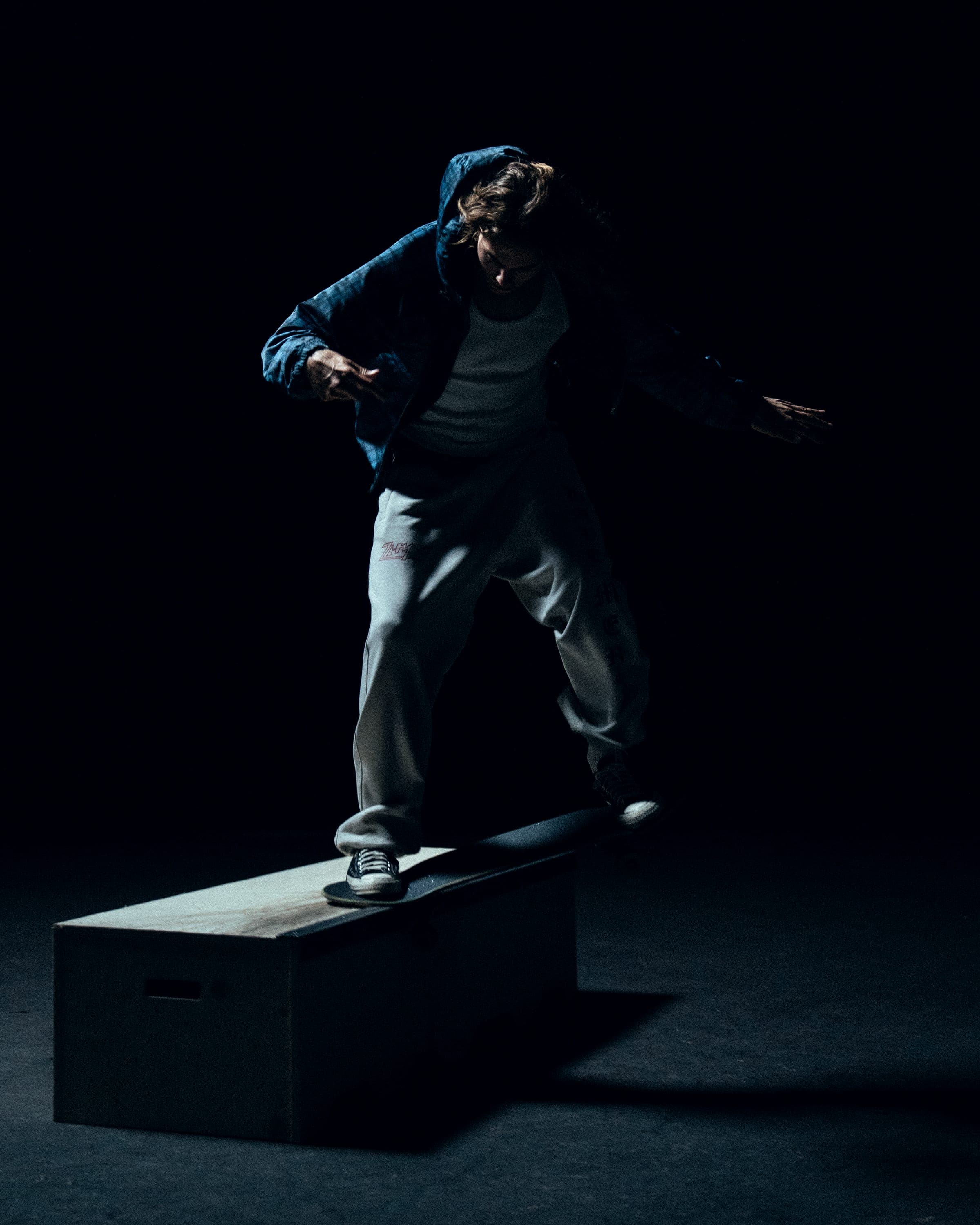 Campaign shoot: skater lit against black